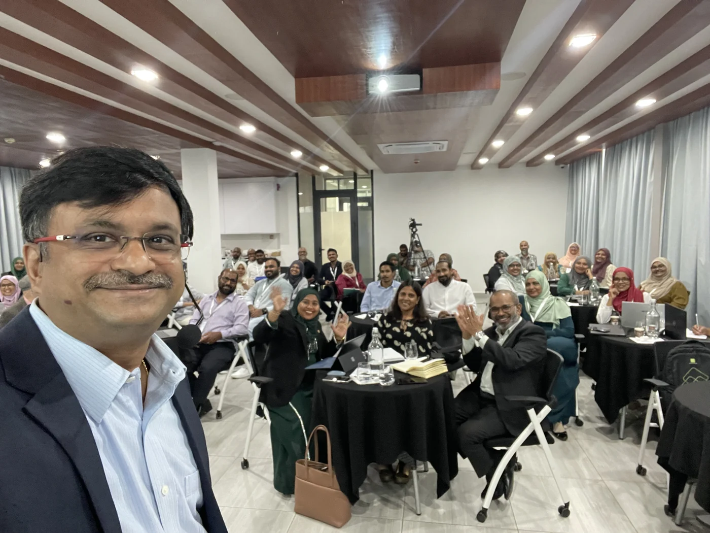 Venkatarangan Thirumalai with a room of business leaders after a keynote in the Maldives.